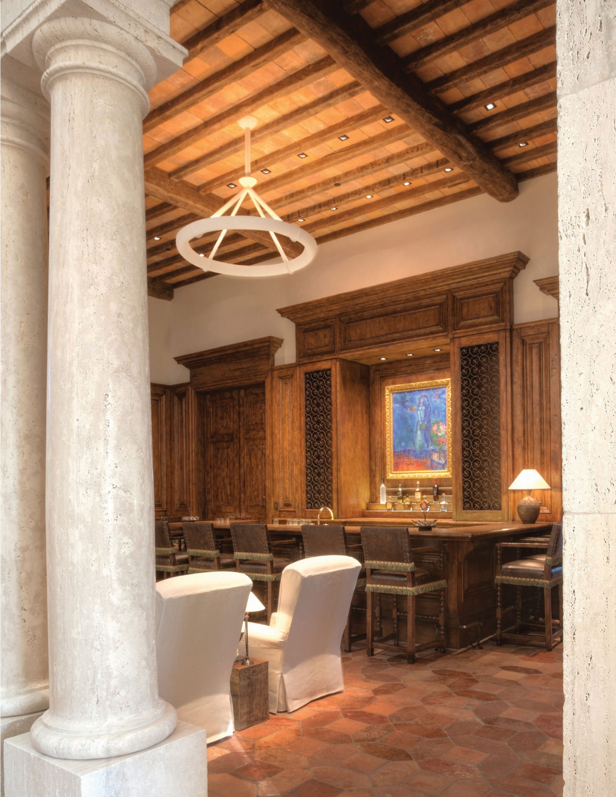 Las Vegas – Lot 8 — Covered loggia with stone columns and view toward the pool at twilight