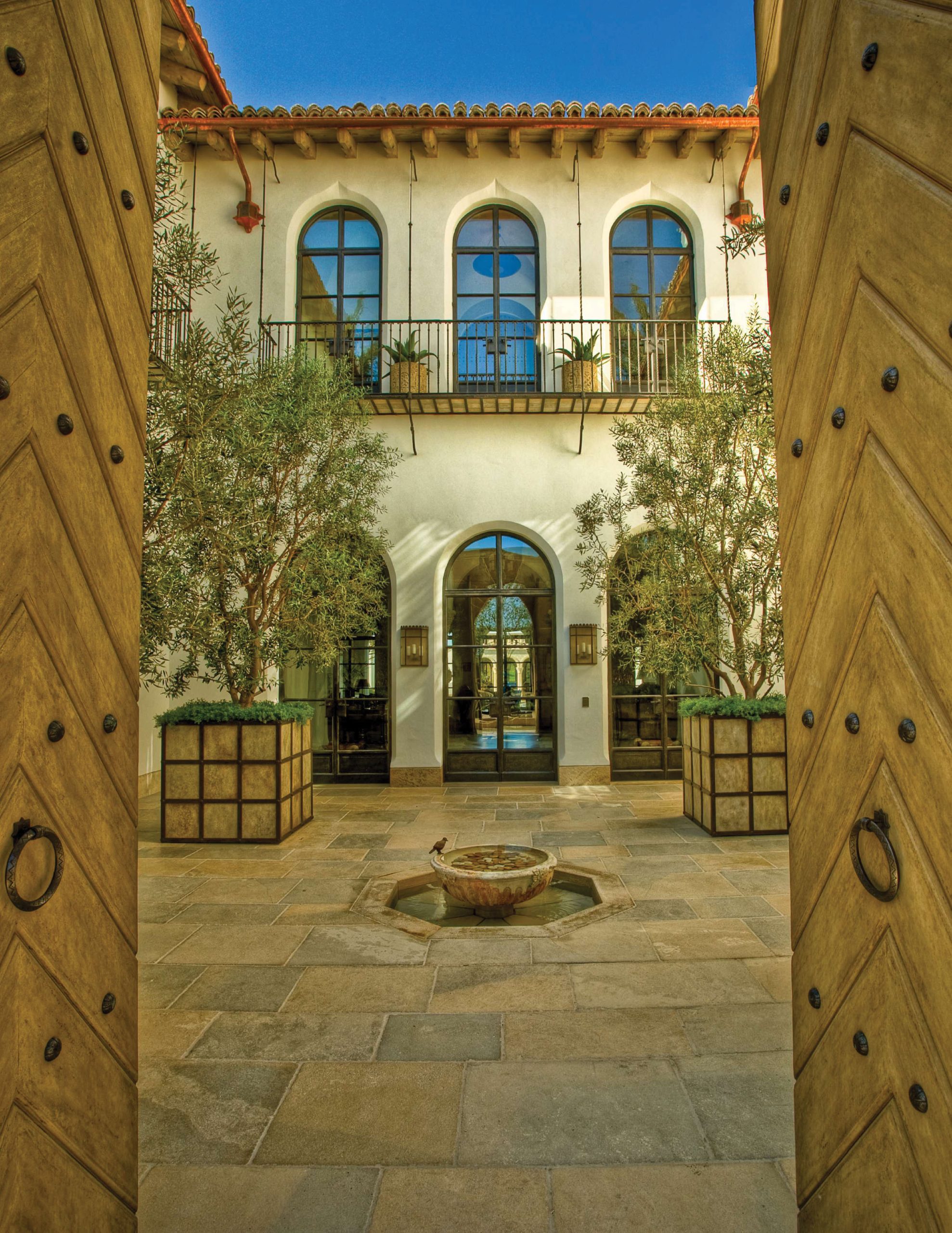 Las Vegas – Lot 8 — Staircase detail with wrought-iron balustrade and carved stone newel