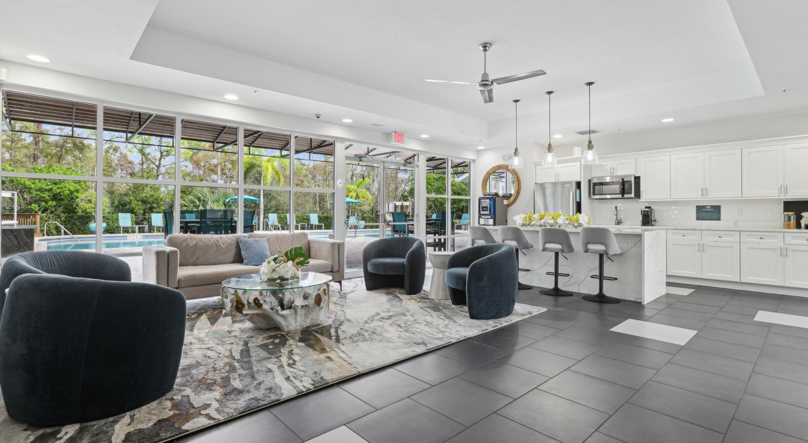 Meadow Brook Preserve — Renovated clubhouse lounge with floor-to-ceiling windows overlooking pool